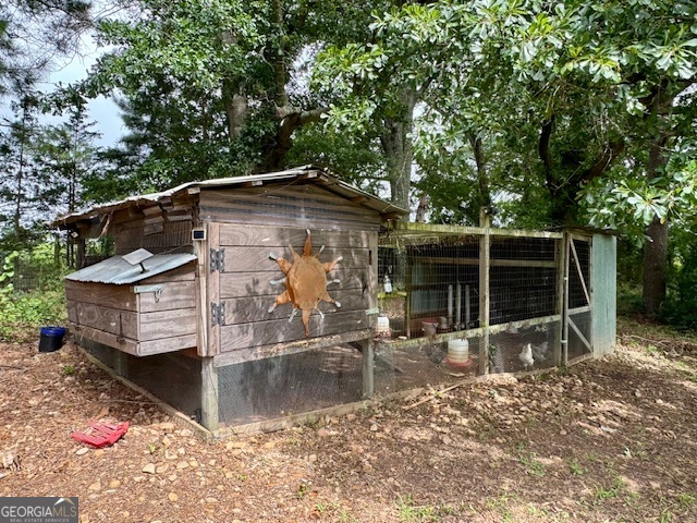 360 Morgan Mill Road Brooks, GA 30205 - Photo 71 of 87 a backyard of a house with barbeque oven