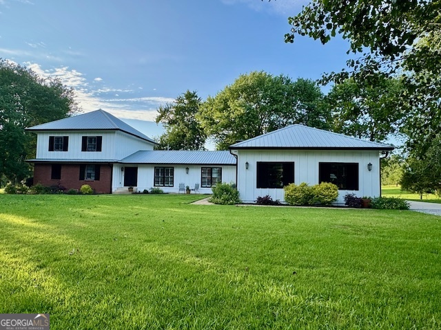 360 Morgan Mill Road Brooks, GA 30205 - Photo 81 of 87 a view of a house with a big yard and potted plants and large trees