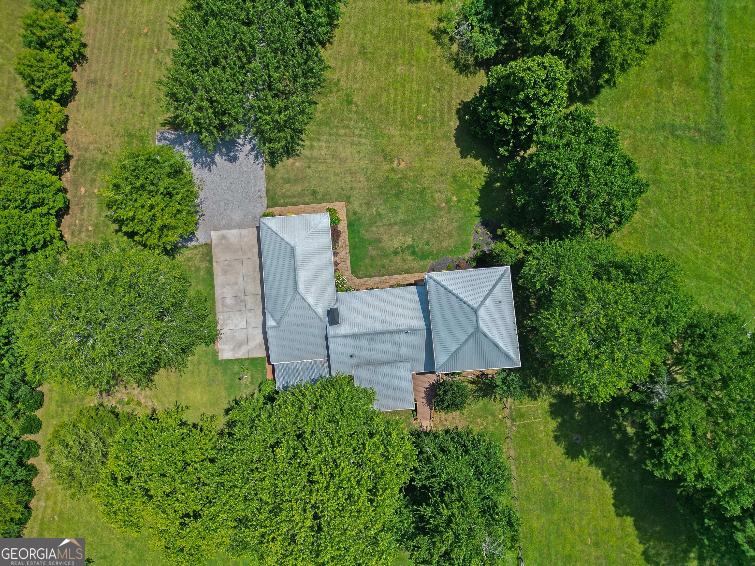 360 Morgan Mill Road Brooks, GA 30205 - Photo 83 of 87 an aerial view of a house with pool garden and trees