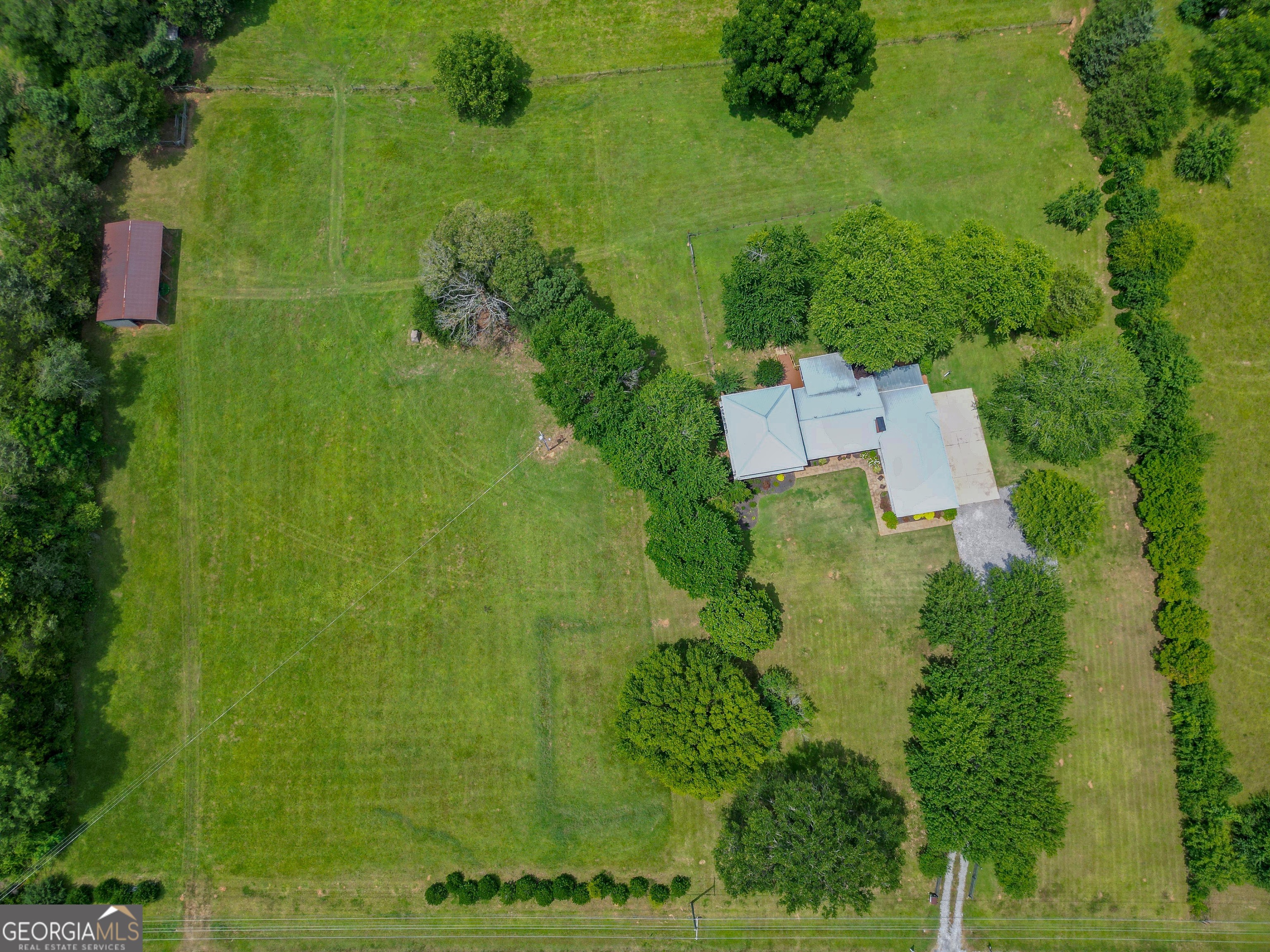 360 Morgan Mill Road Brooks, GA 30205 - Photo 86 of 87 an aerial view of a house with a yard