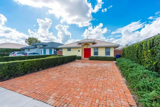 a view of house with yard