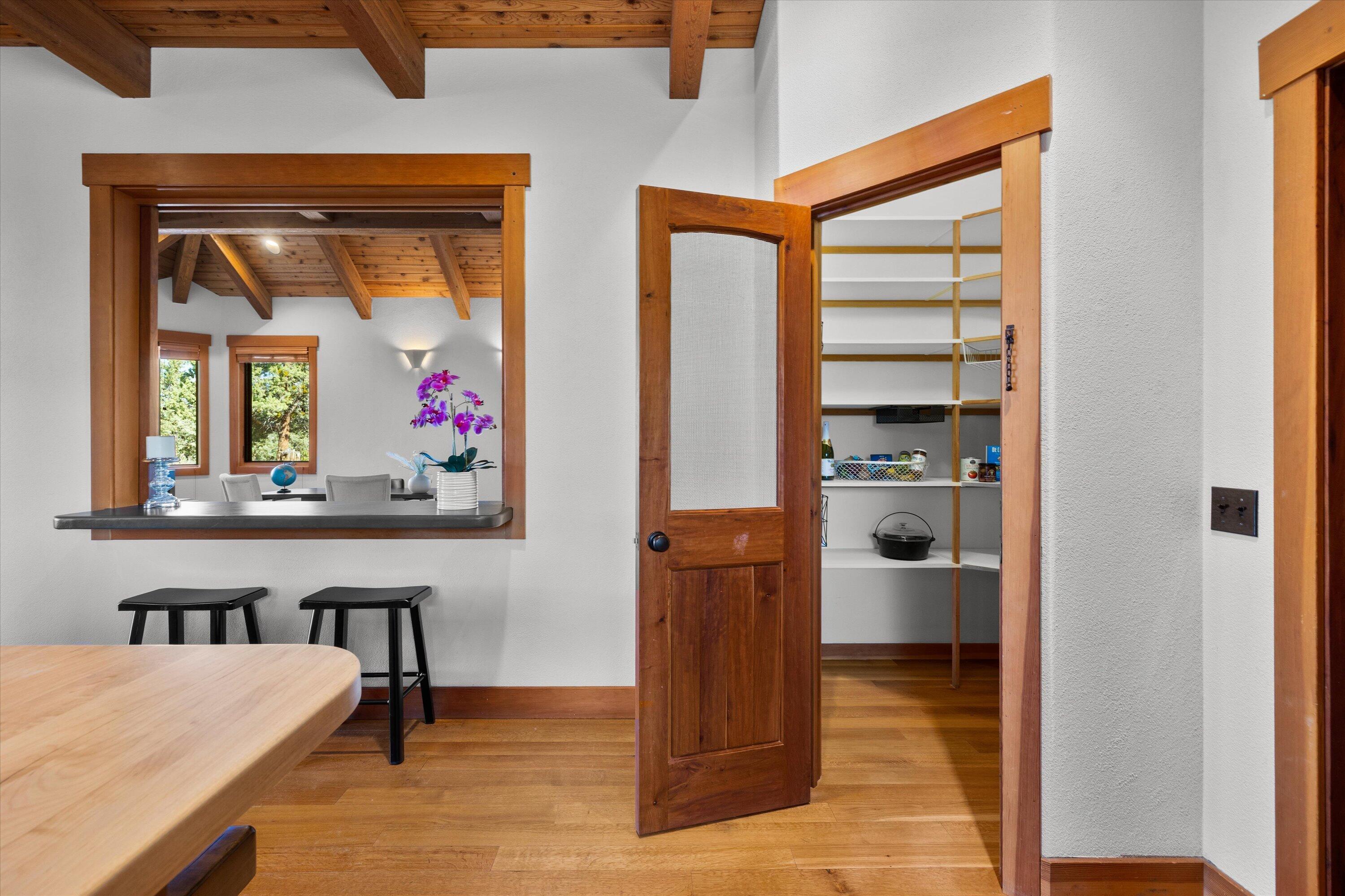 64155 Hunnell Road Bend, OR 97703 - Photo 29 of 96 Corner pantry with shelving.