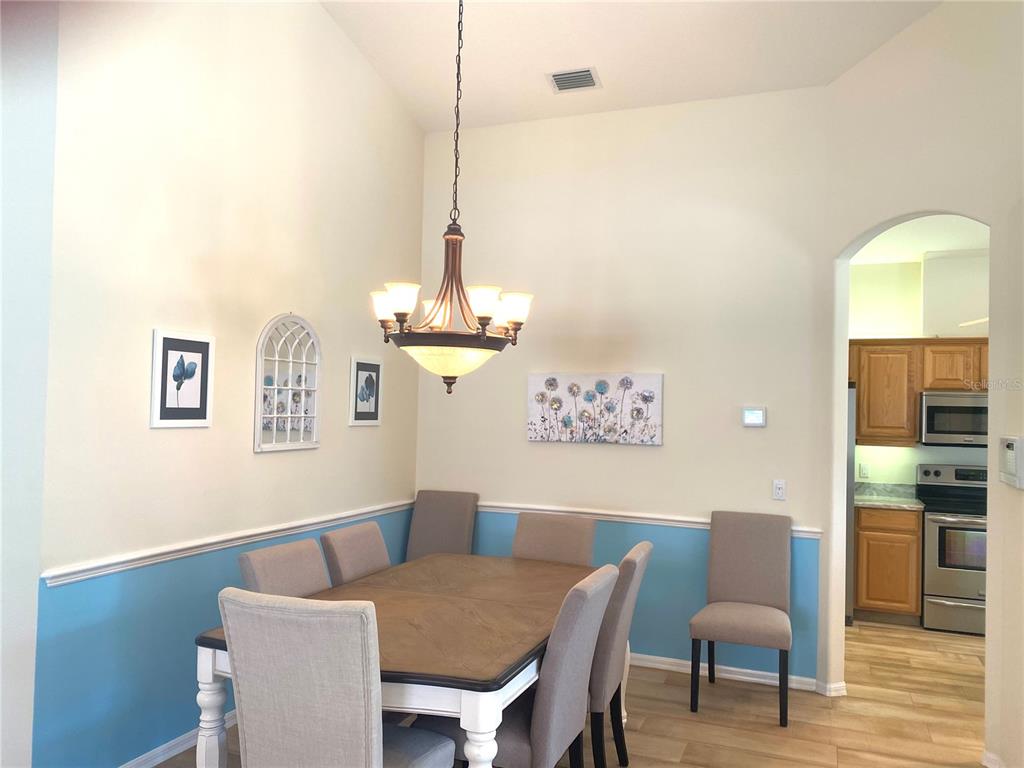 6372 Rookery Circle Bradenton, FL 34203 - Photo 12 of 46 a view of a dining room with furniture