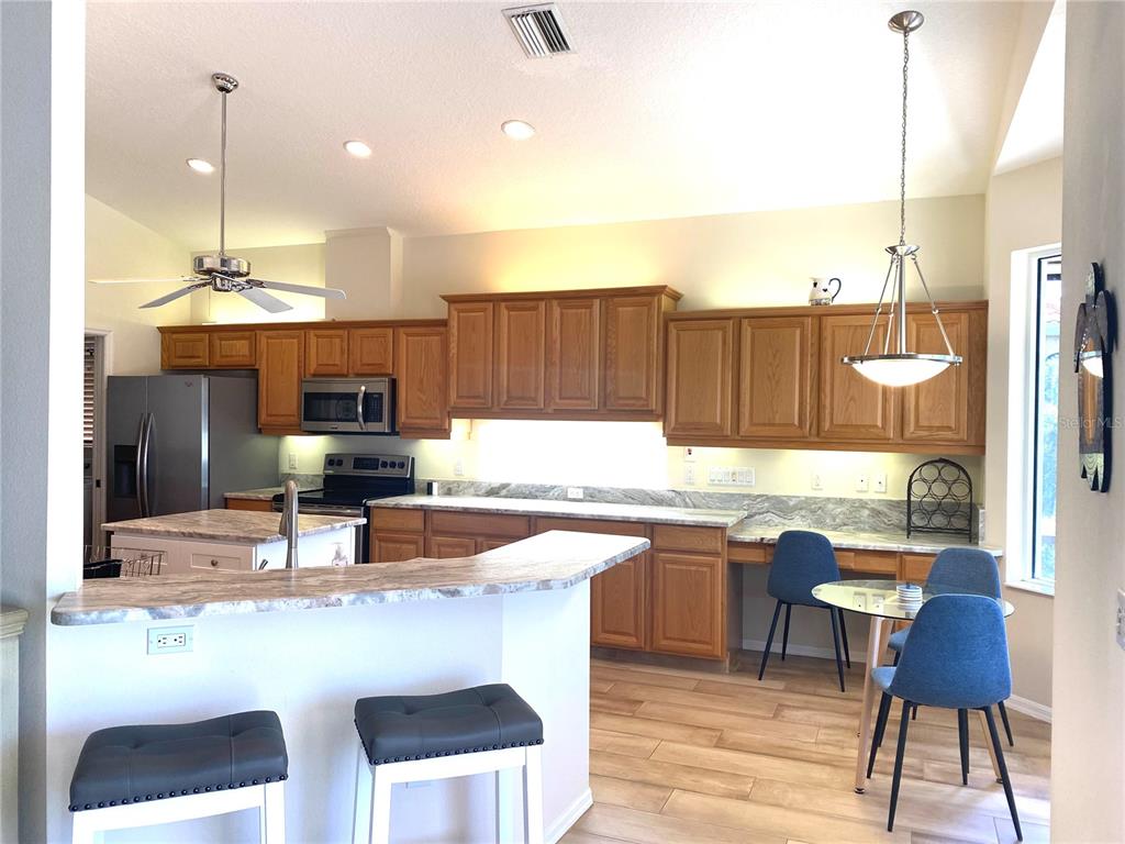 6372 Rookery Circle Bradenton, FL 34203 - Photo 15 of 46 a kitchen with a sink cabinets and window
