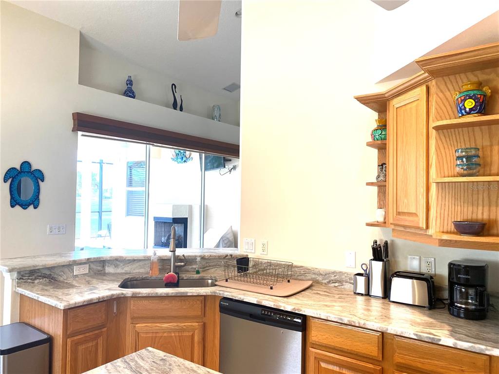 6372 Rookery Circle Bradenton, FL 34203 - Photo 17 of 46 a kitchen with a sink and a stove top oven