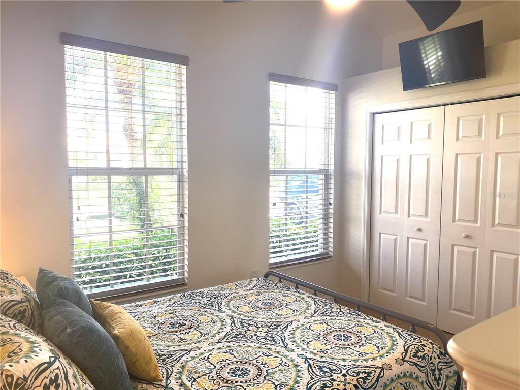 6372 Rookery Circle Bradenton, FL 34203 - Photo 27 of 46 a bedroom with a bed and a television