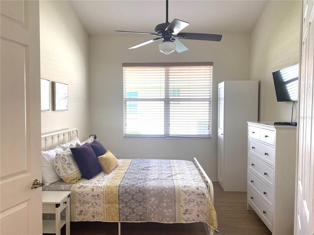 6372 Rookery Circle Bradenton, FL 34203 - Photo 29 of 46 a bedroom with a bed and a flat tv screen