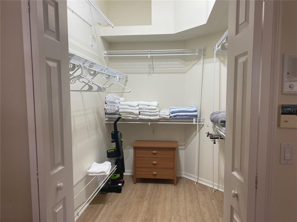 6372 Rookery Circle Bradenton, FL 34203 - Photo 35 of 46 a view of walk in closet with clothes and shoes