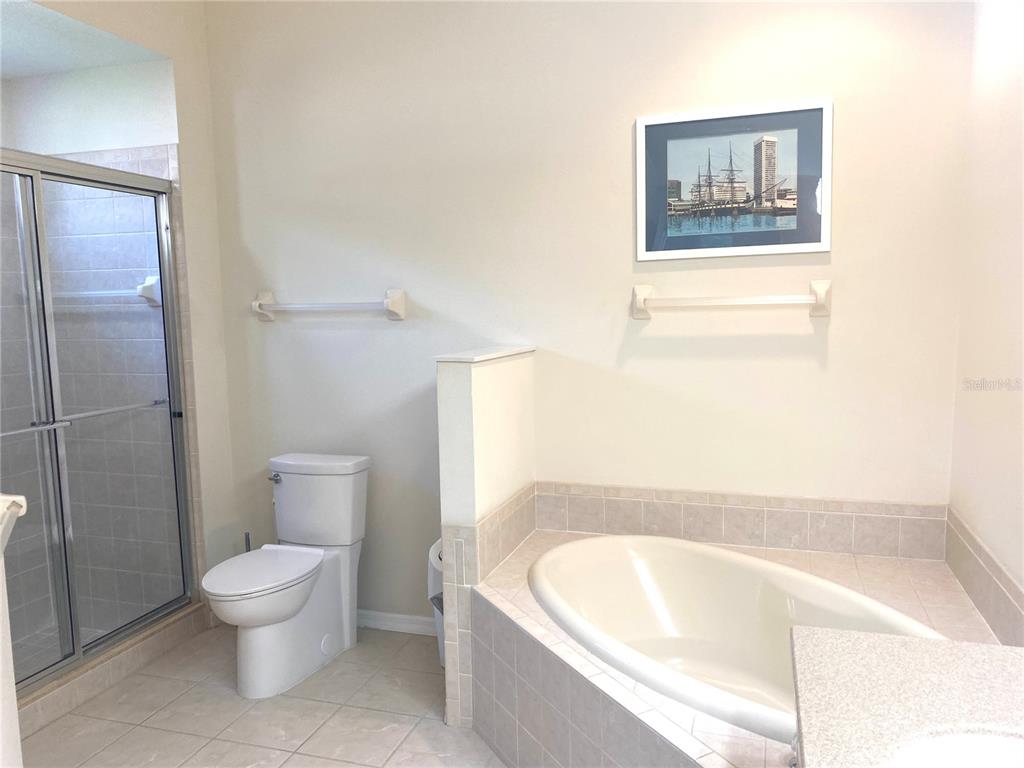 6372 Rookery Circle Bradenton, FL 34203 - Photo 37 of 46 a bathroom with a toilet and a bathtub