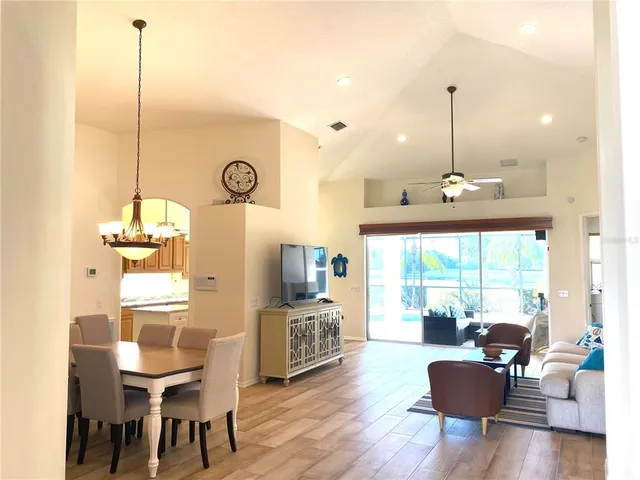 a living room with furniture window and wooden floor