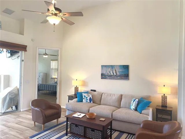 a living room with furniture and a window