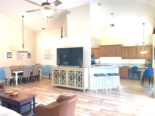 a living room with lots of furniture and a flat screen tv