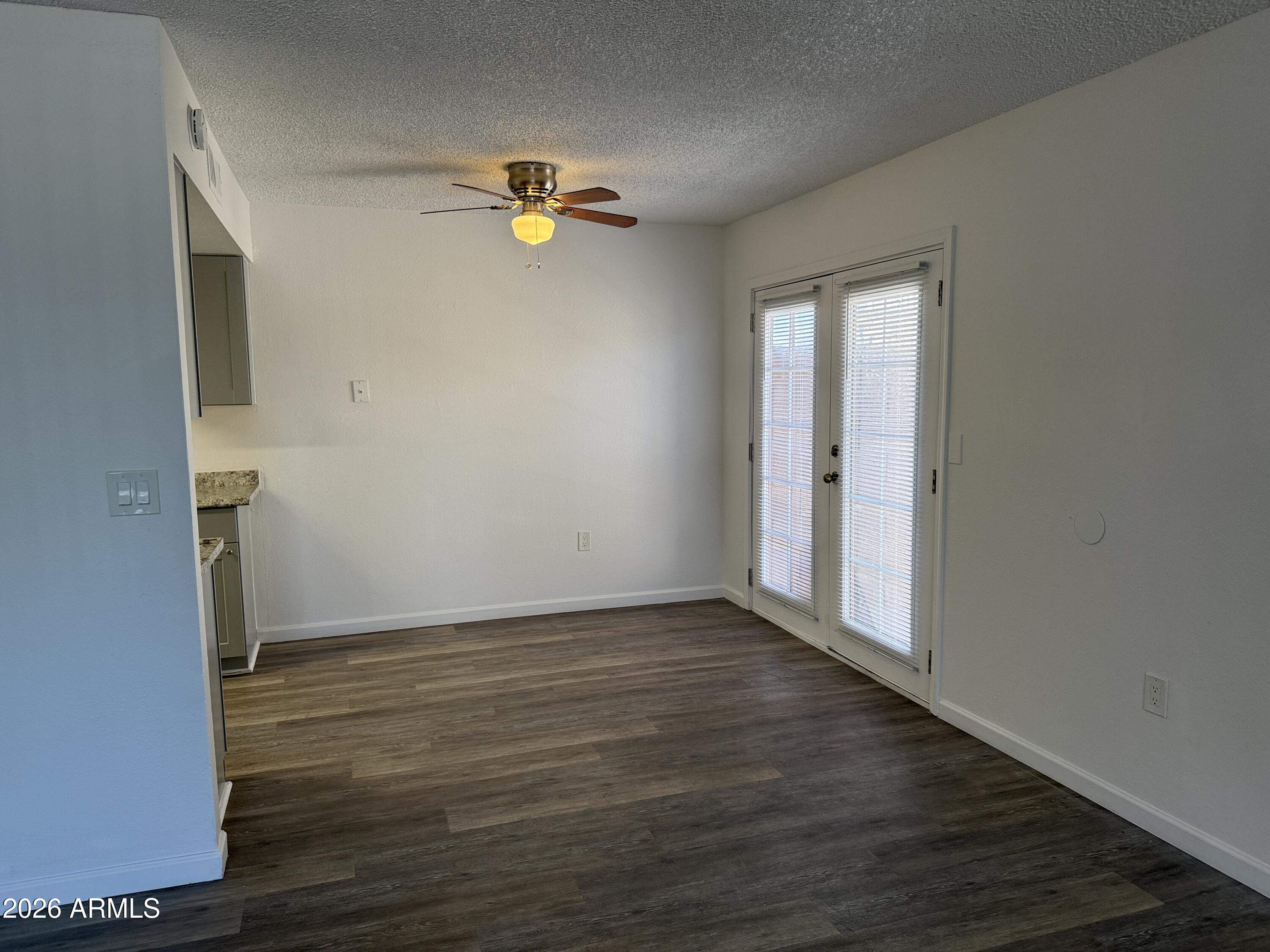 860 East Brown Road, Unit 53 Mesa, AZ 85203 - Photo 5 of 14 a view of empty room with wooden floor