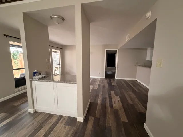 a view of a living hall with wooden floor and staircase