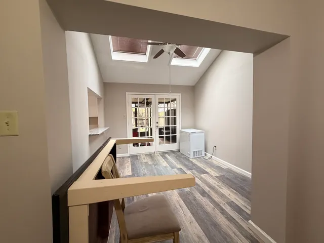 a room with a bed and a window