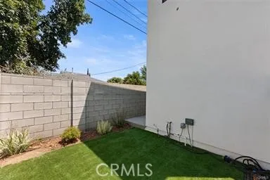 a view of wooden door and a yard
