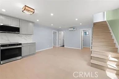a view of kitchen with microwave and stove