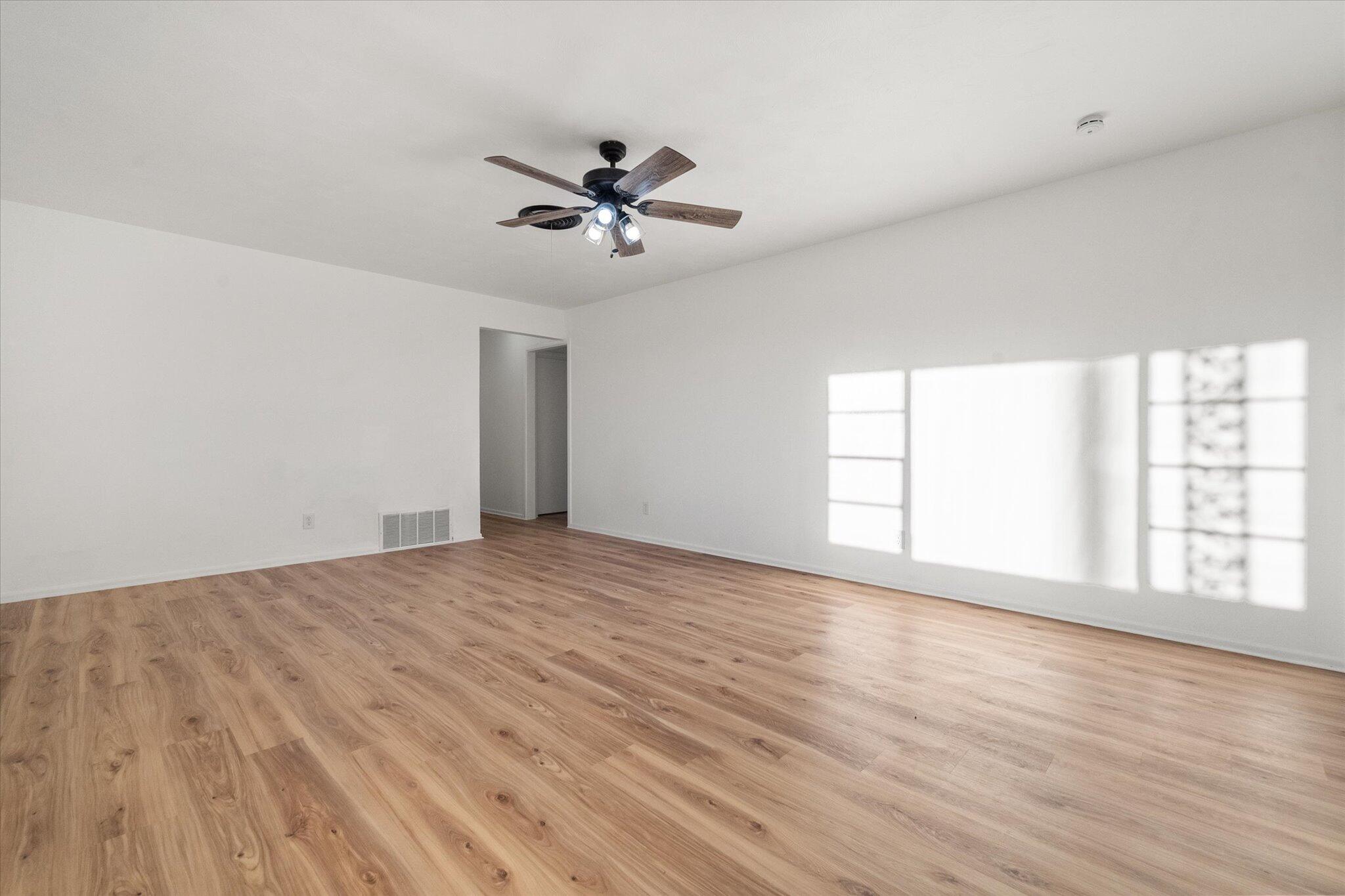 1312 Culpepper Avenue Wilson, TX 79381 - Photo 12 of 27 a view of empty room with wooden floor and fan