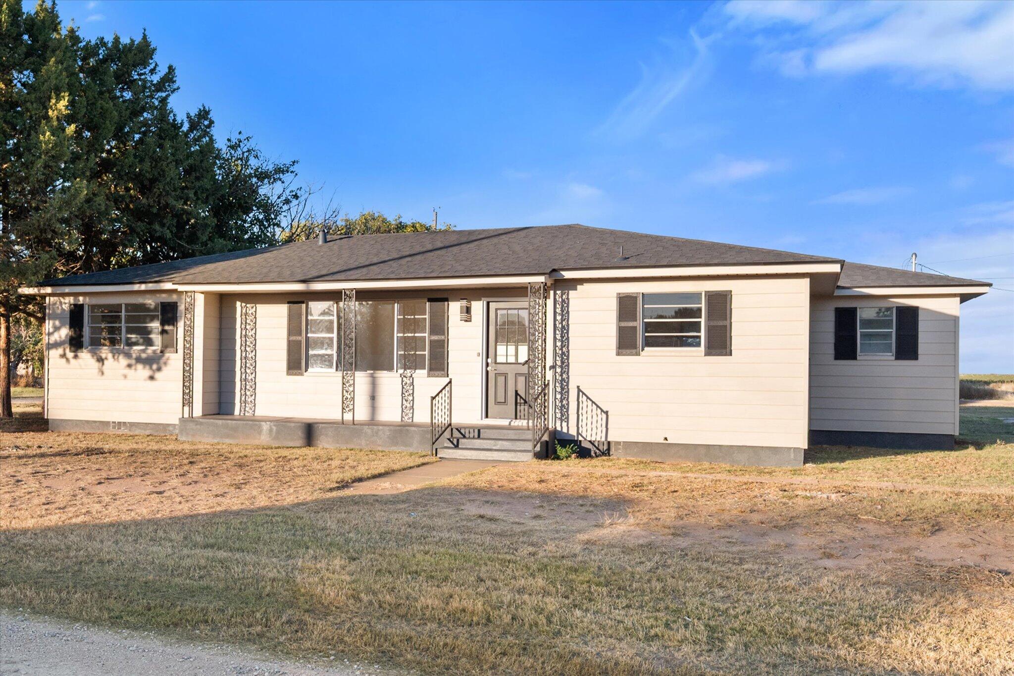 1312 Culpepper Avenue Wilson, TX 79381 - Photo 2 of 27 a front view of a house with a yard