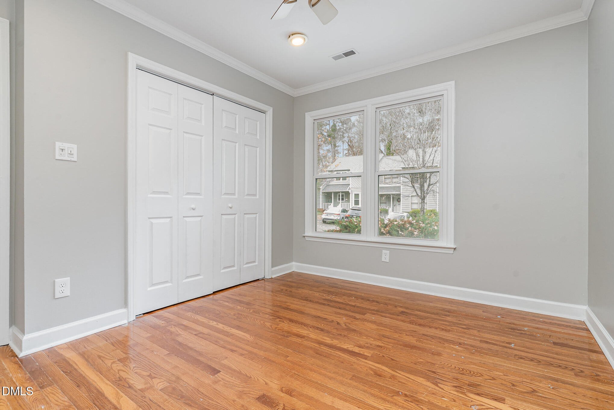 417 Applecross Drive Cary, NC 27511 - Photo 16 of 24 a view of empty room with wooden floor and fan