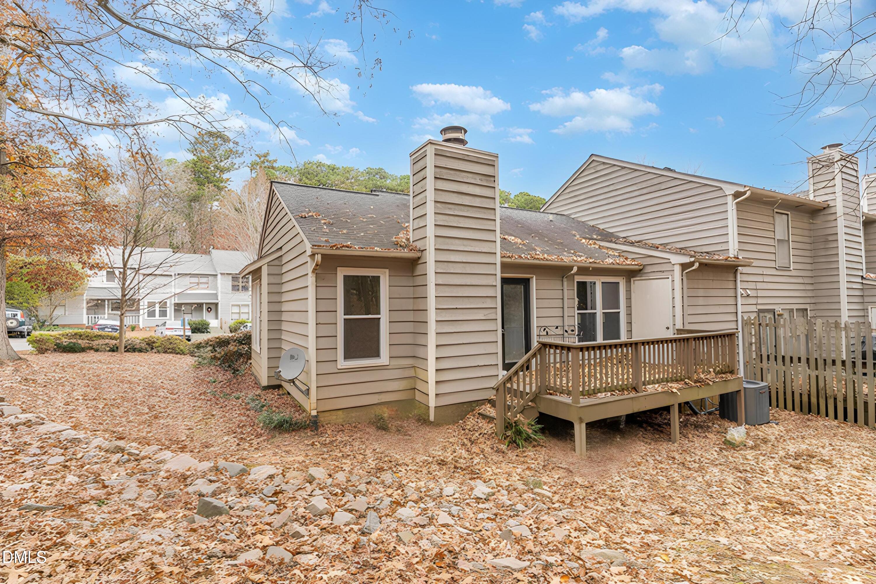 417 Applecross Drive Cary, NC 27511 - Photo 22 of 24 a backyard of a house with barbeque oven table and chairs