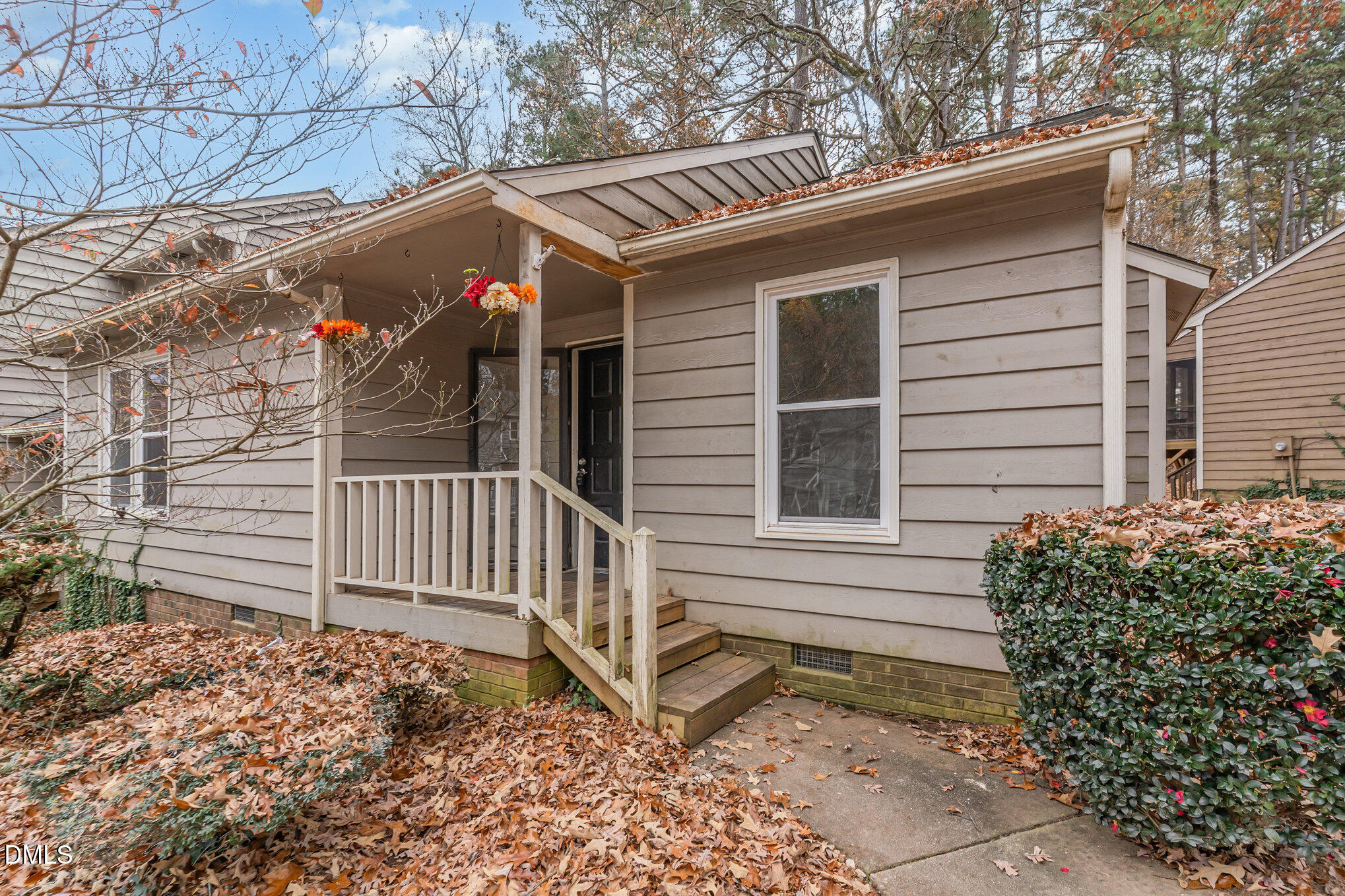 417 Applecross Drive Cary, NC 27511 - Photo 2 of 24 a view of wooden house with a small yard and wooden fence