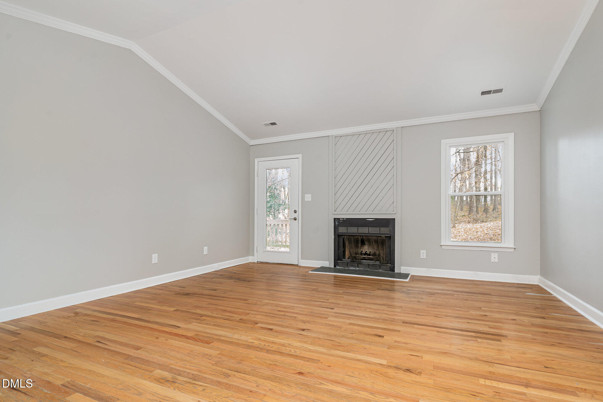 417 Applecross Drive Cary, NC 27511 - Photo 5 of 24 wooden floor fireplace and windows in an empty room