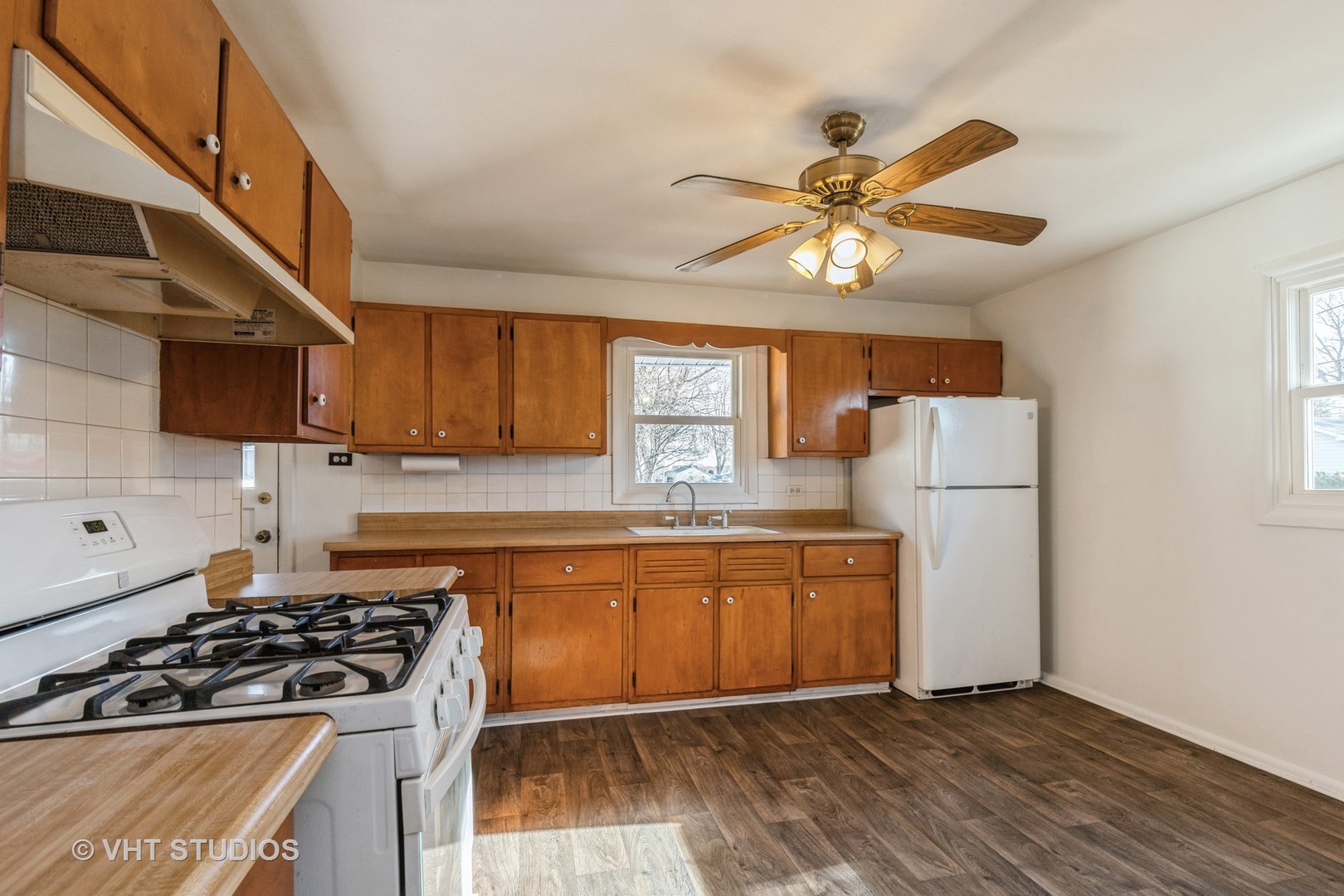 238 Allanson Road Mundelein, IL 60060 - Photo 12 of 18 a kitchen with stainless steel appliances granite countertop a stove a sink and a refrigerator