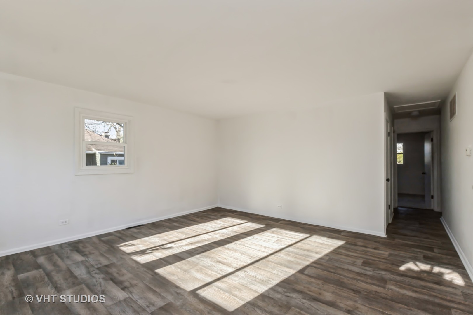238 Allanson Road Mundelein, IL 60060 - Photo 5 of 18 a view of a room with wooden floor and white walls