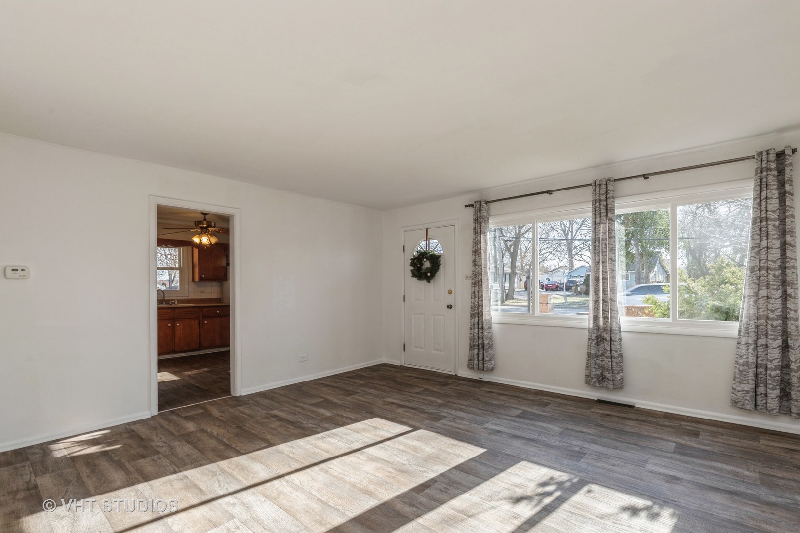 238 Allanson Road Mundelein, IL 60060 - Photo 7 of 18 a view of empty room with wooden floor and fan