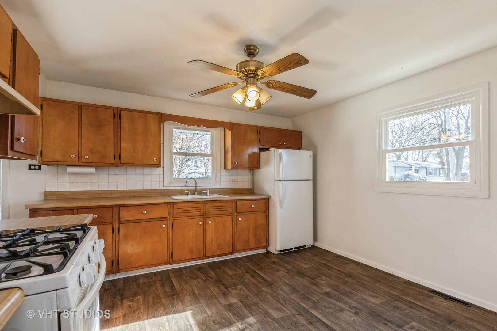 238 Allanson Road Mundelein, IL 60060 - Photo 8 of 18 a kitchen with stainless steel appliances granite countertop a stove a sink dishwasher and a refrigerator
