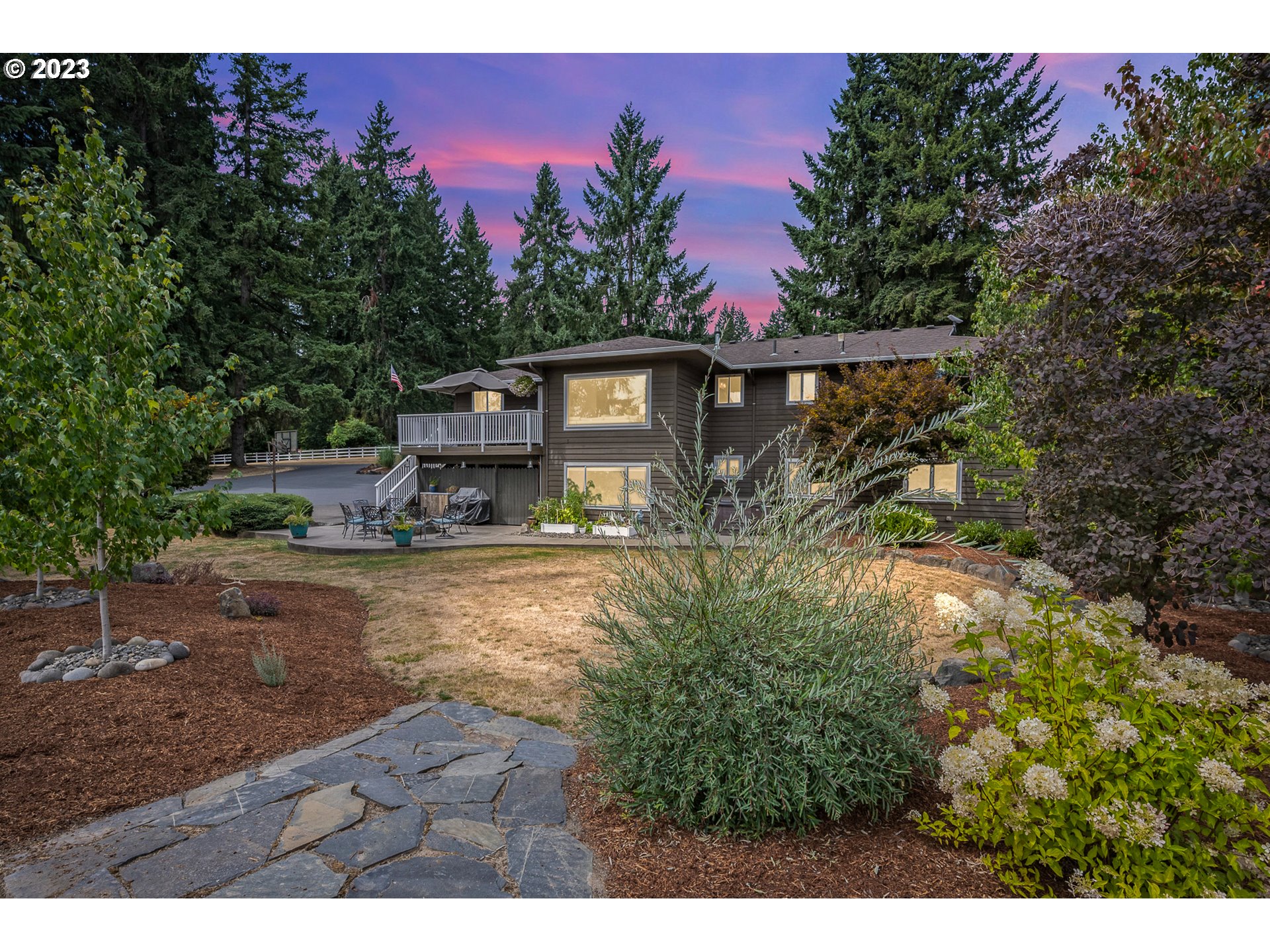 a backyard of a house with lots of green space