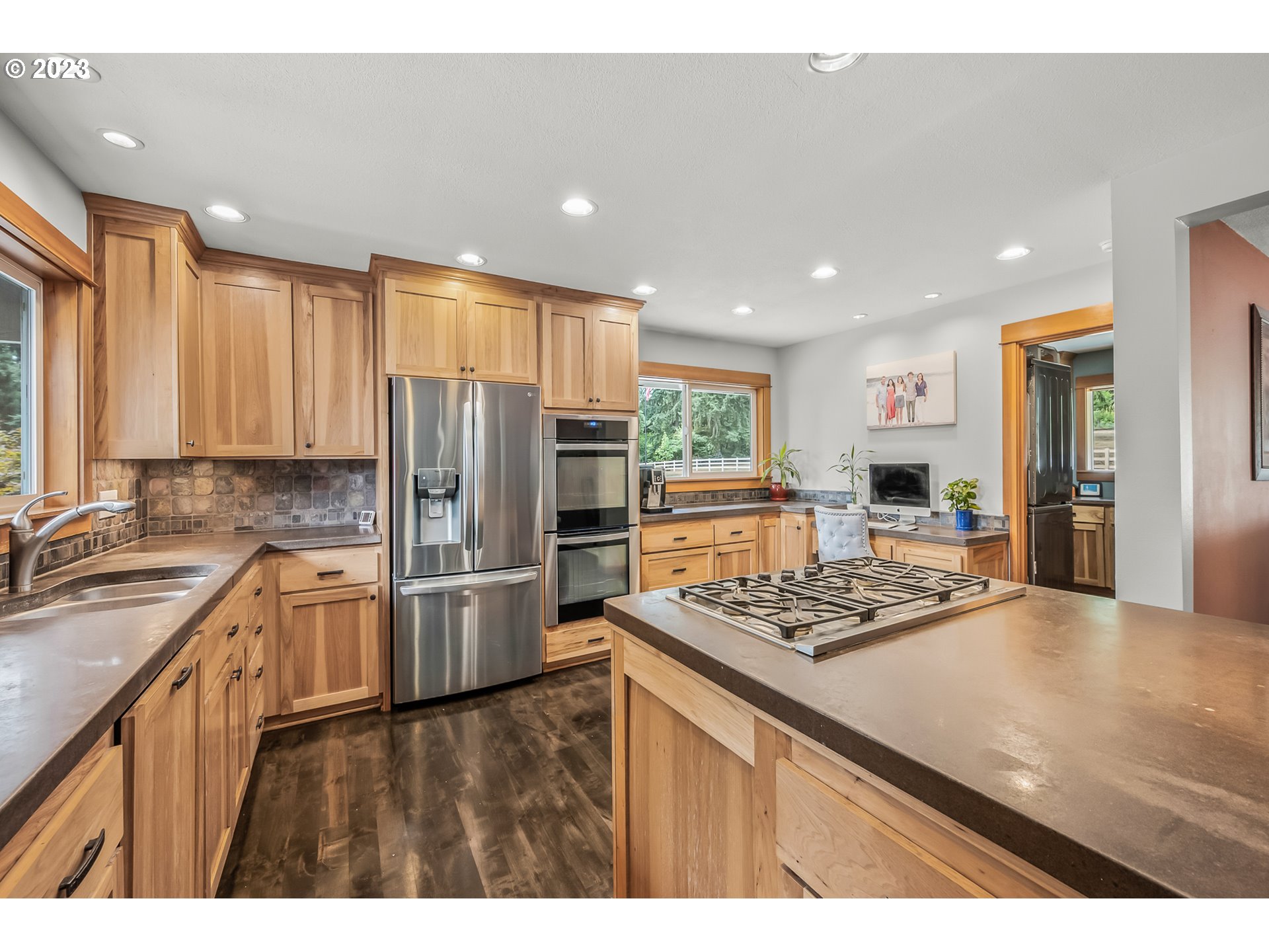 32311 Viewcrest Drive Warren, OR 97053 - Photo 12 of 46 a kitchen with stainless steel appliances granite countertop a sink stove and refrigerator