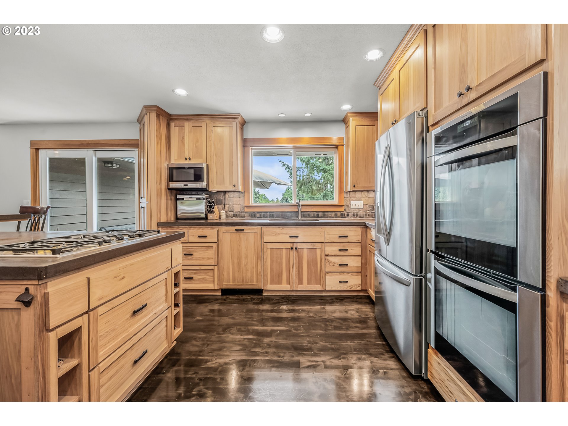 32311 Viewcrest Drive Warren, OR 97053 - Photo 13 of 46 a kitchen with stainless steel appliances granite countertop a refrigerator sink and cabinets