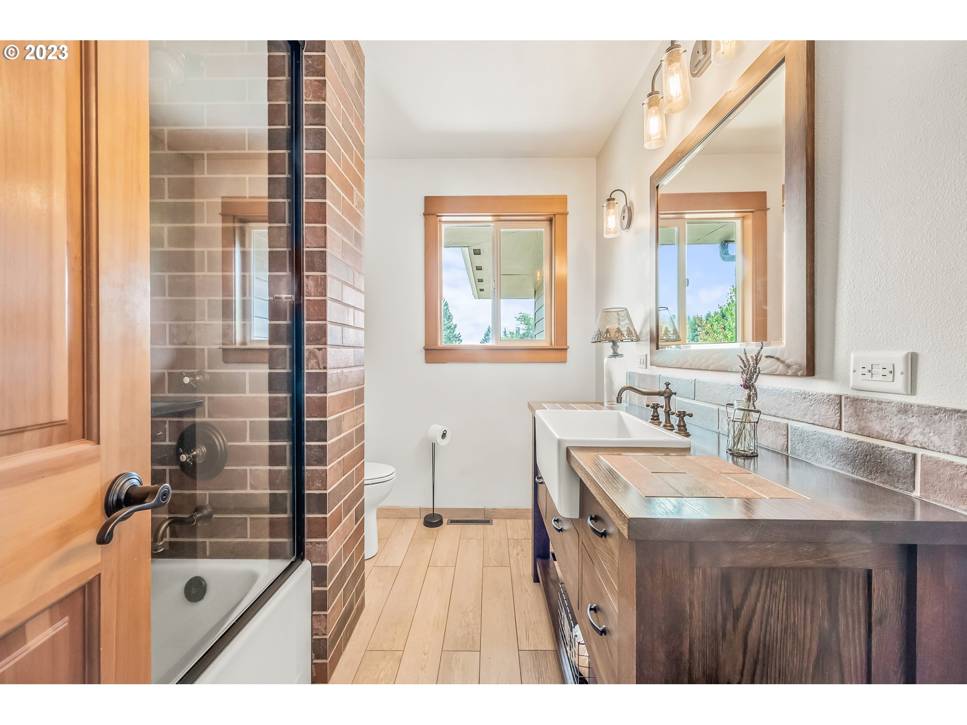 32311 Viewcrest Drive Warren, OR 97053 - Photo 17 of 46 a bathroom with a tub sink and mirror