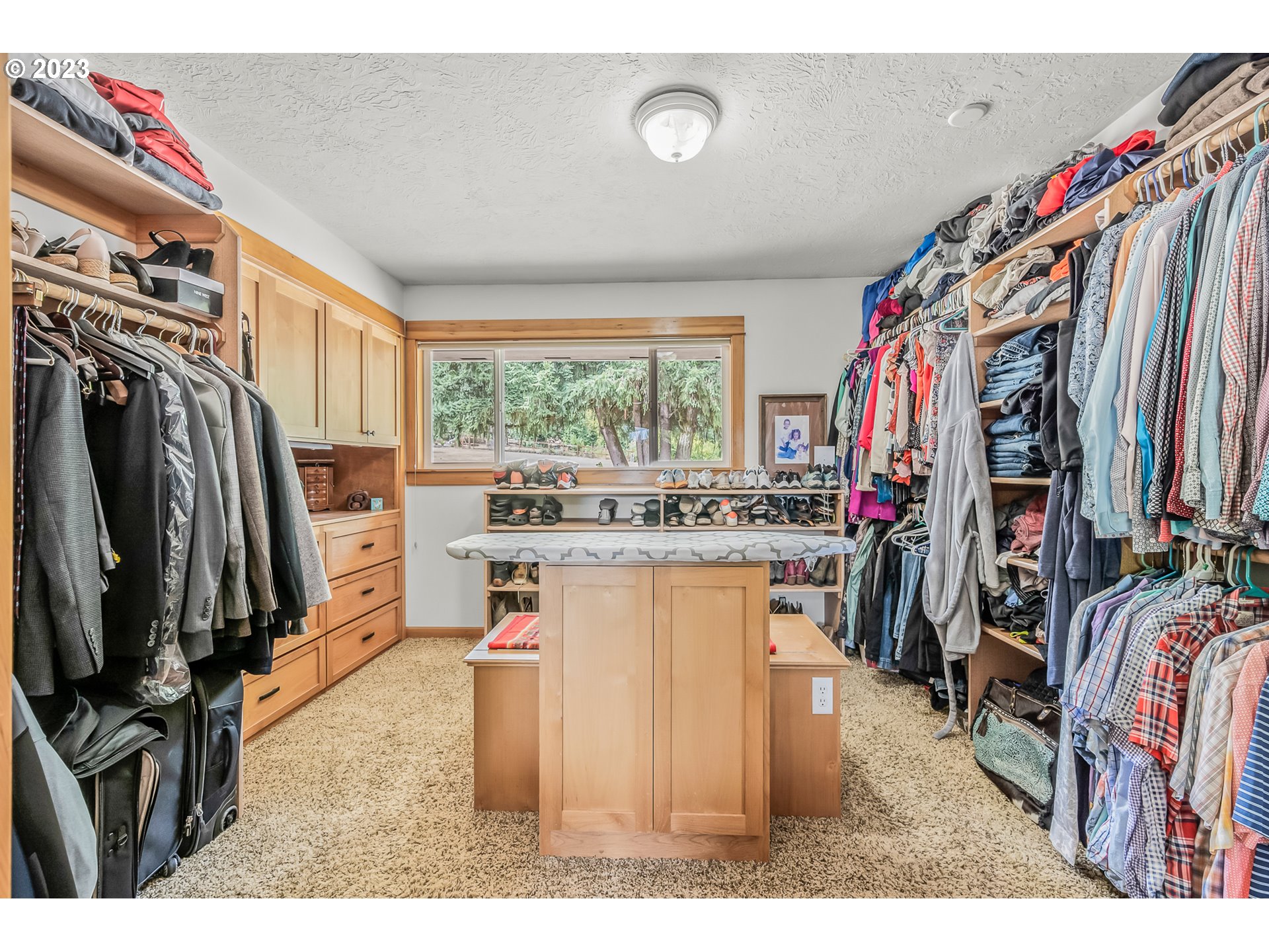 32311 Viewcrest Drive Warren, OR 97053 - Photo 19 of 46 a view of walk in closet with clothes and shoes