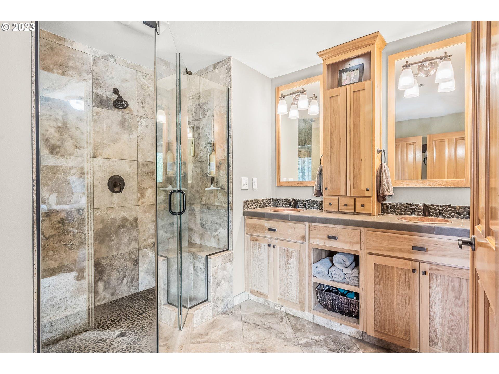 32311 Viewcrest Drive Warren, OR 97053 - Photo 20 of 46 a bathroom with a granite countertop sink and a mirror