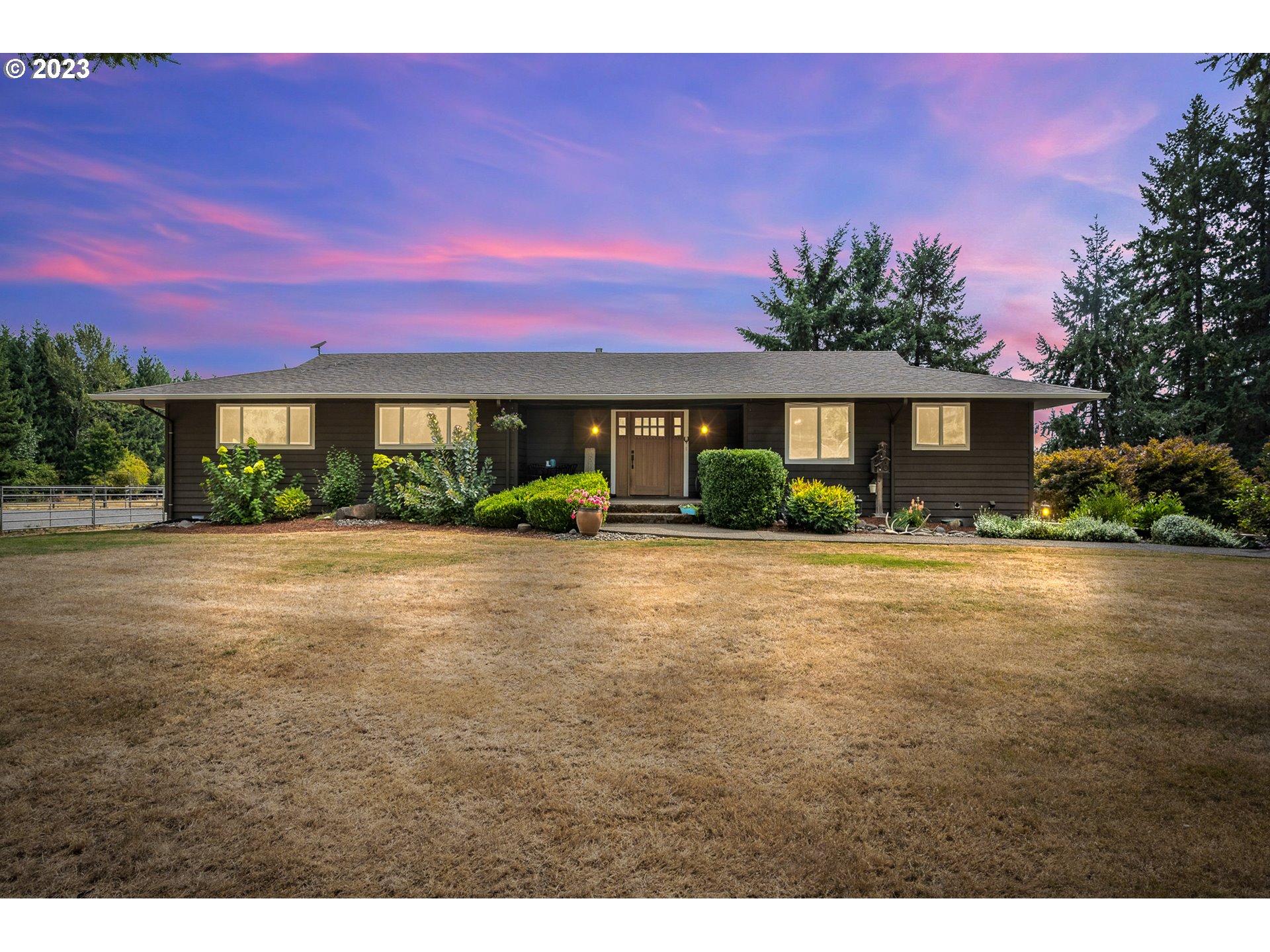 32311 Viewcrest Drive Warren, OR 97053 - Photo 2 of 46 a front view of a house with a yard and a garage