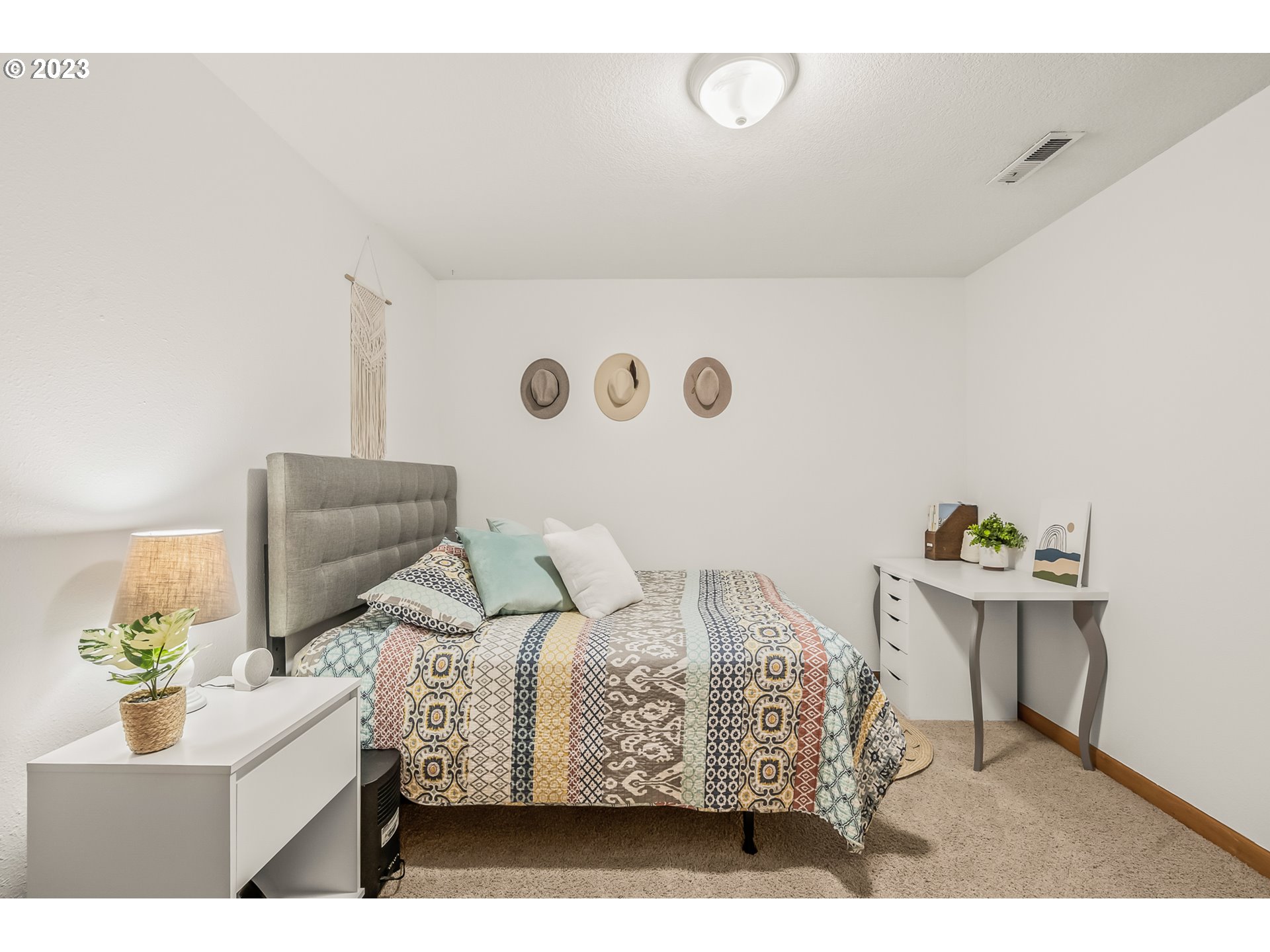 32311 Viewcrest Drive Warren, OR 97053 - Photo 21 of 46 a bedroom with a bed and a table