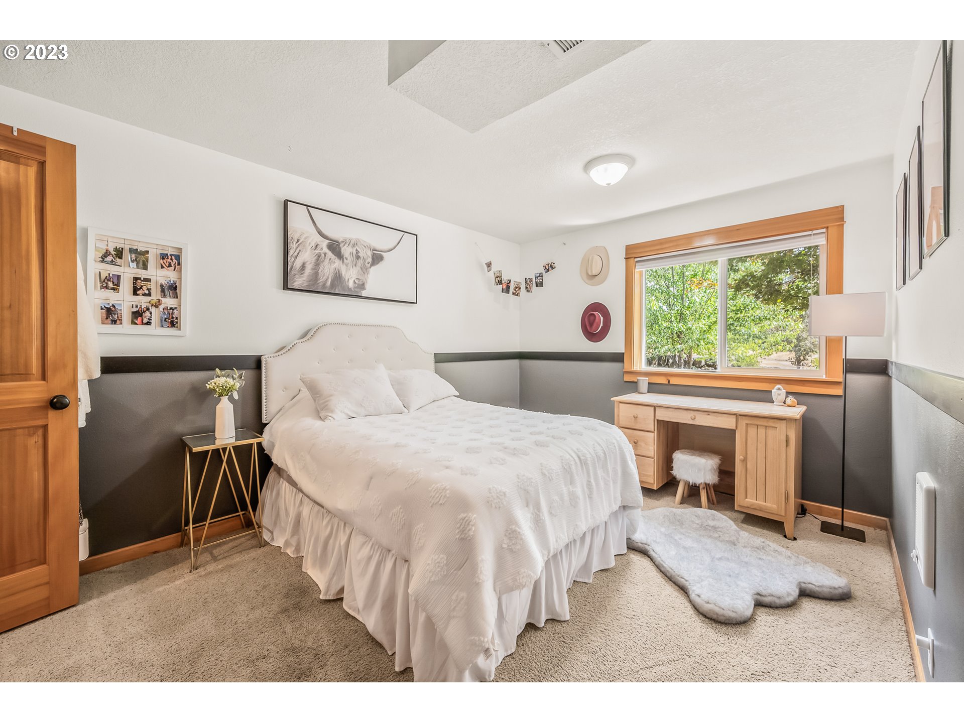 32311 Viewcrest Drive Warren, OR 97053 - Photo 23 of 46 a bedroom with a bed and a window