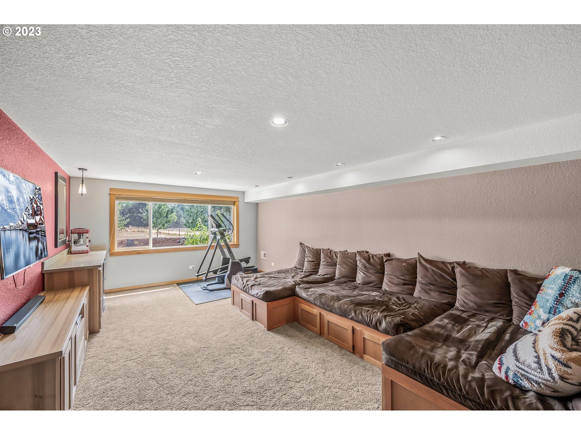 32311 Viewcrest Drive Warren, OR 97053 - Photo 24 of 46 a living room with furniture and a large window