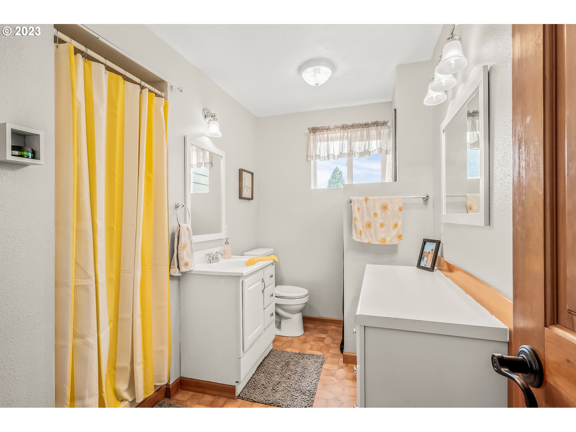 32311 Viewcrest Drive Warren, OR 97053 - Photo 25 of 46 a bathroom with a sink a toilet and a mirror