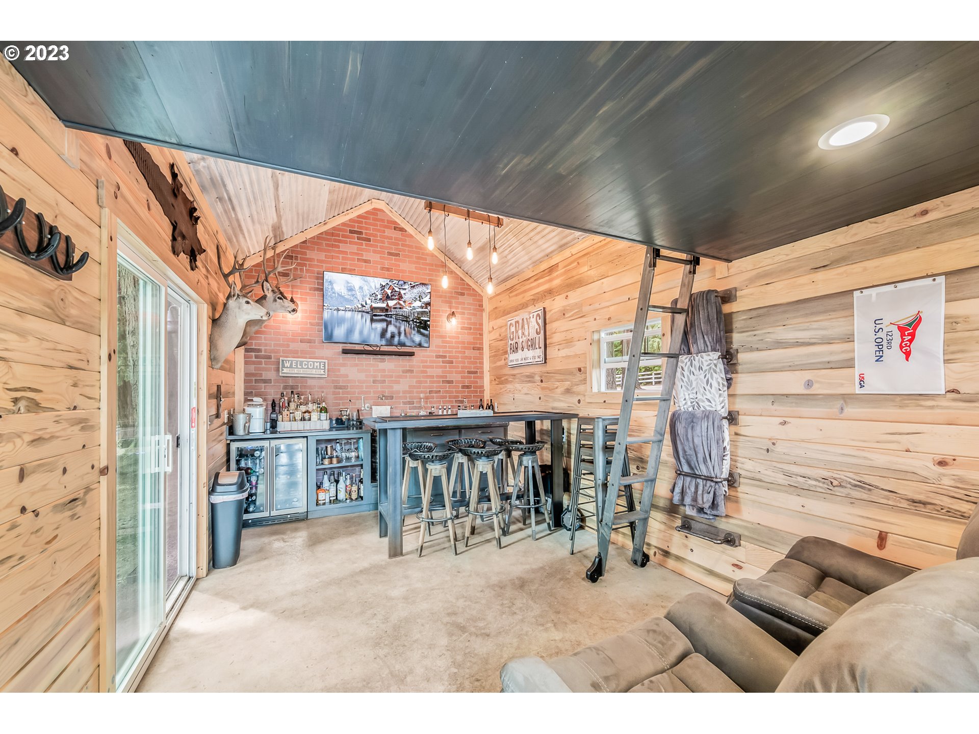 32311 Viewcrest Drive Warren, OR 97053 - Photo 27 of 46 a balcony with furniture and a view of city