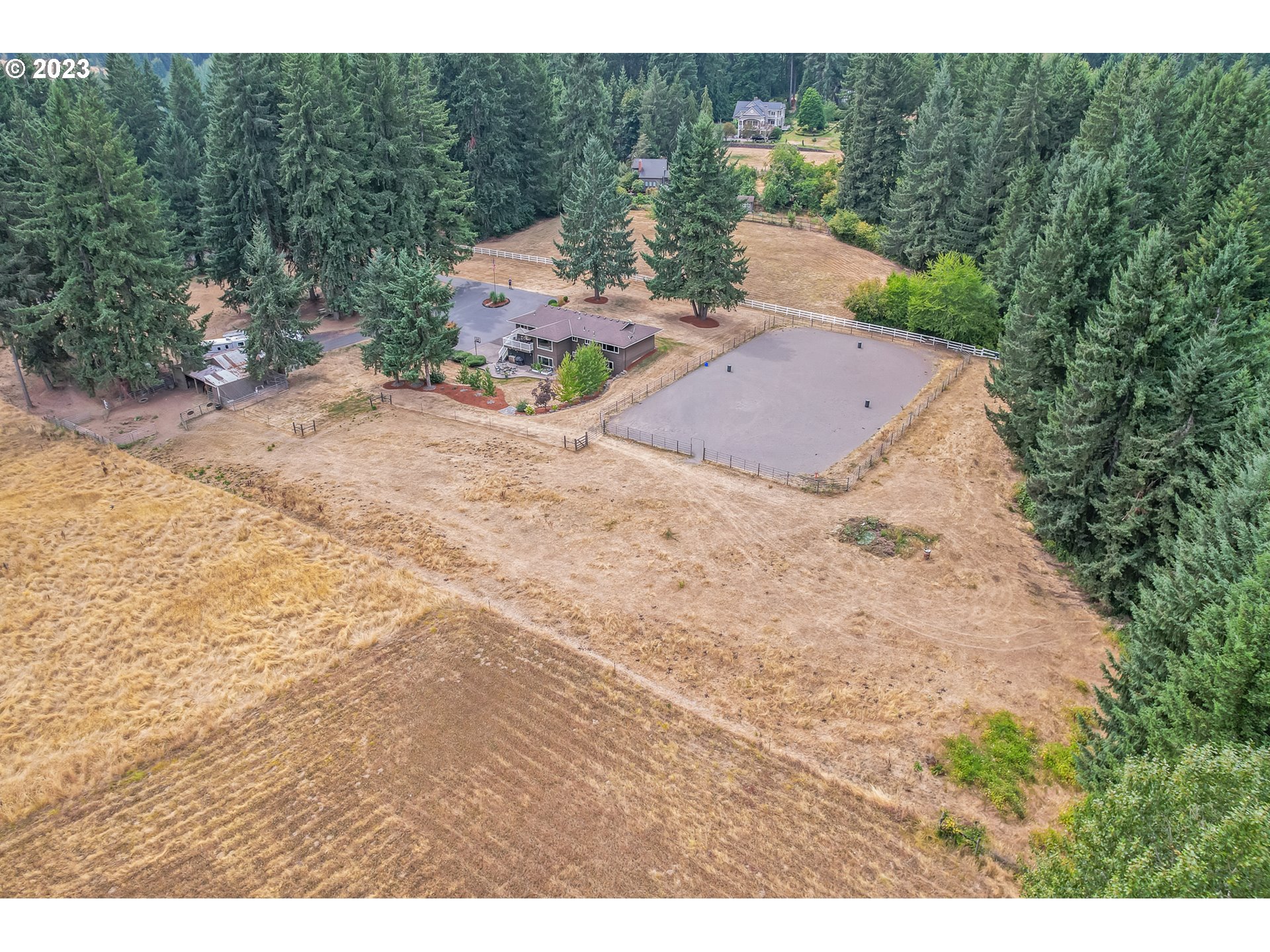 32311 Viewcrest Drive Warren, OR 97053 - Photo 34 of 46 a backyard of a house with table and chairs