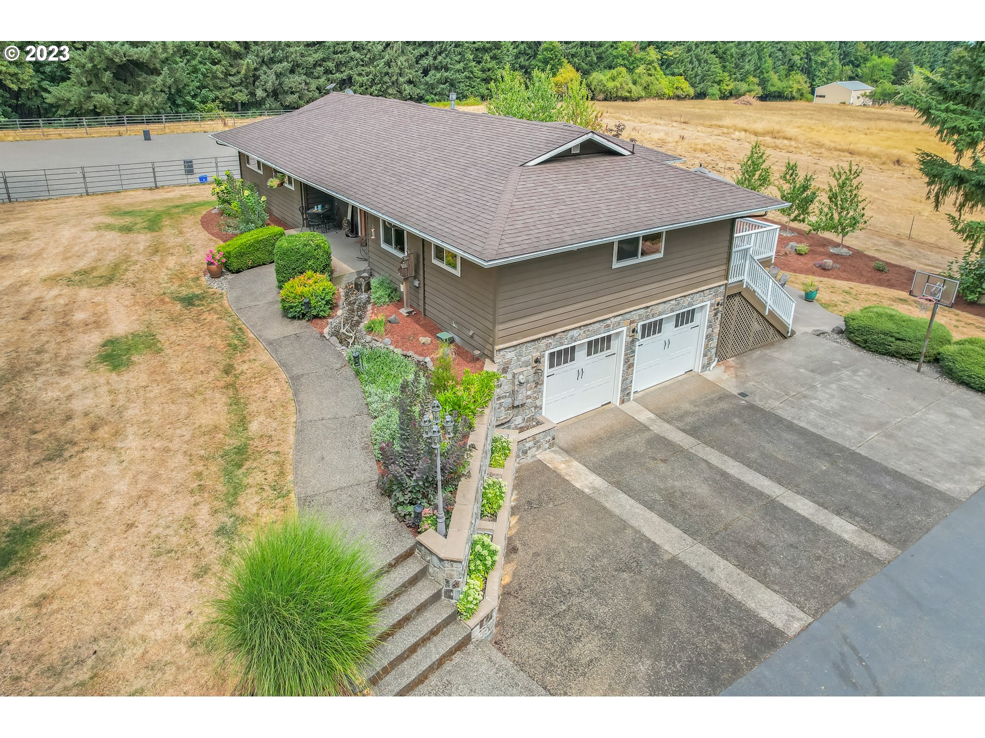 32311 Viewcrest Drive Warren, OR 97053 - Photo 39 of 46 a aerial view of a house with a yard and potted plants