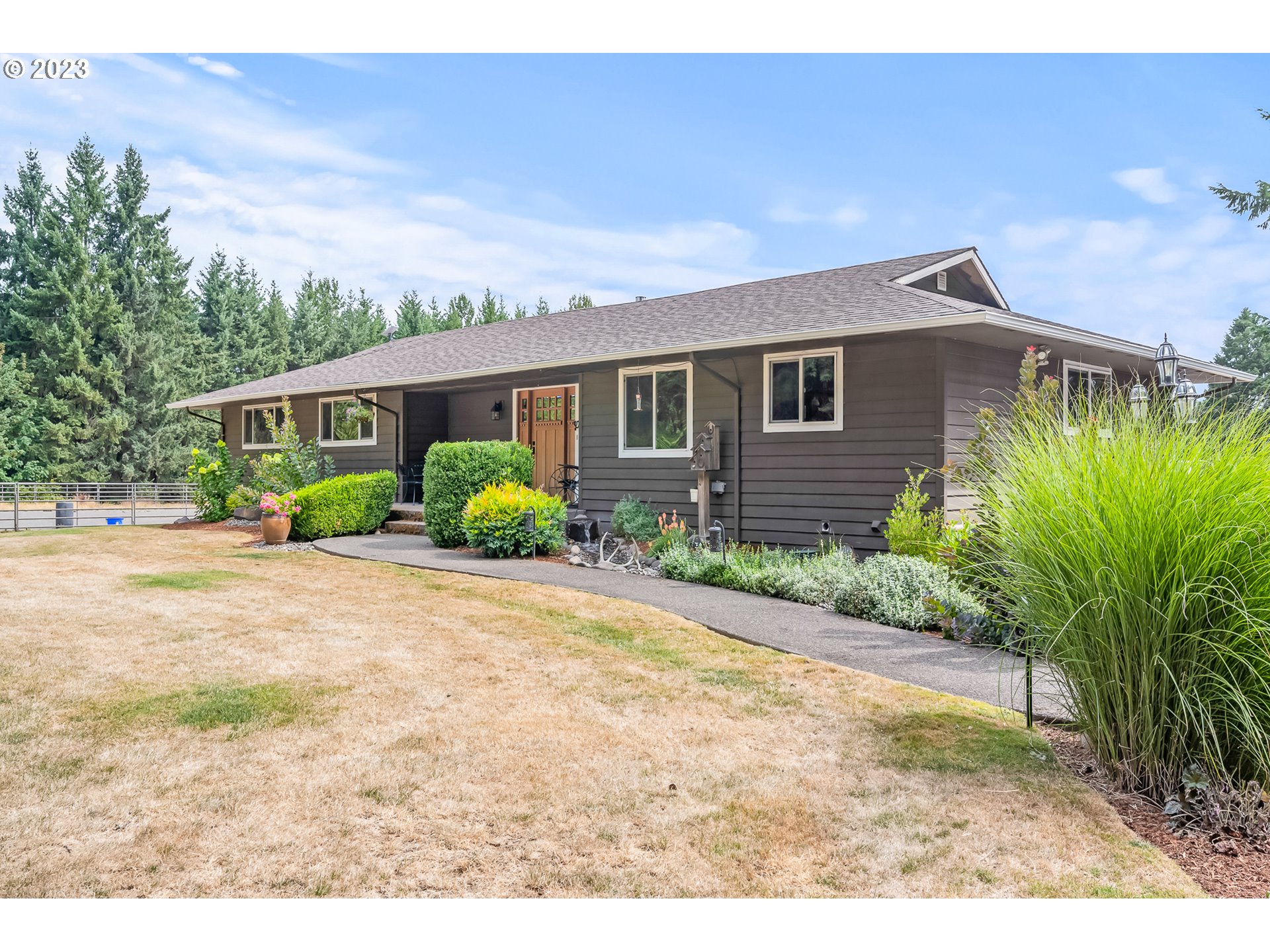 32311 Viewcrest Drive Warren, OR 97053 - Photo 6 of 46 a view of a house with a backyard