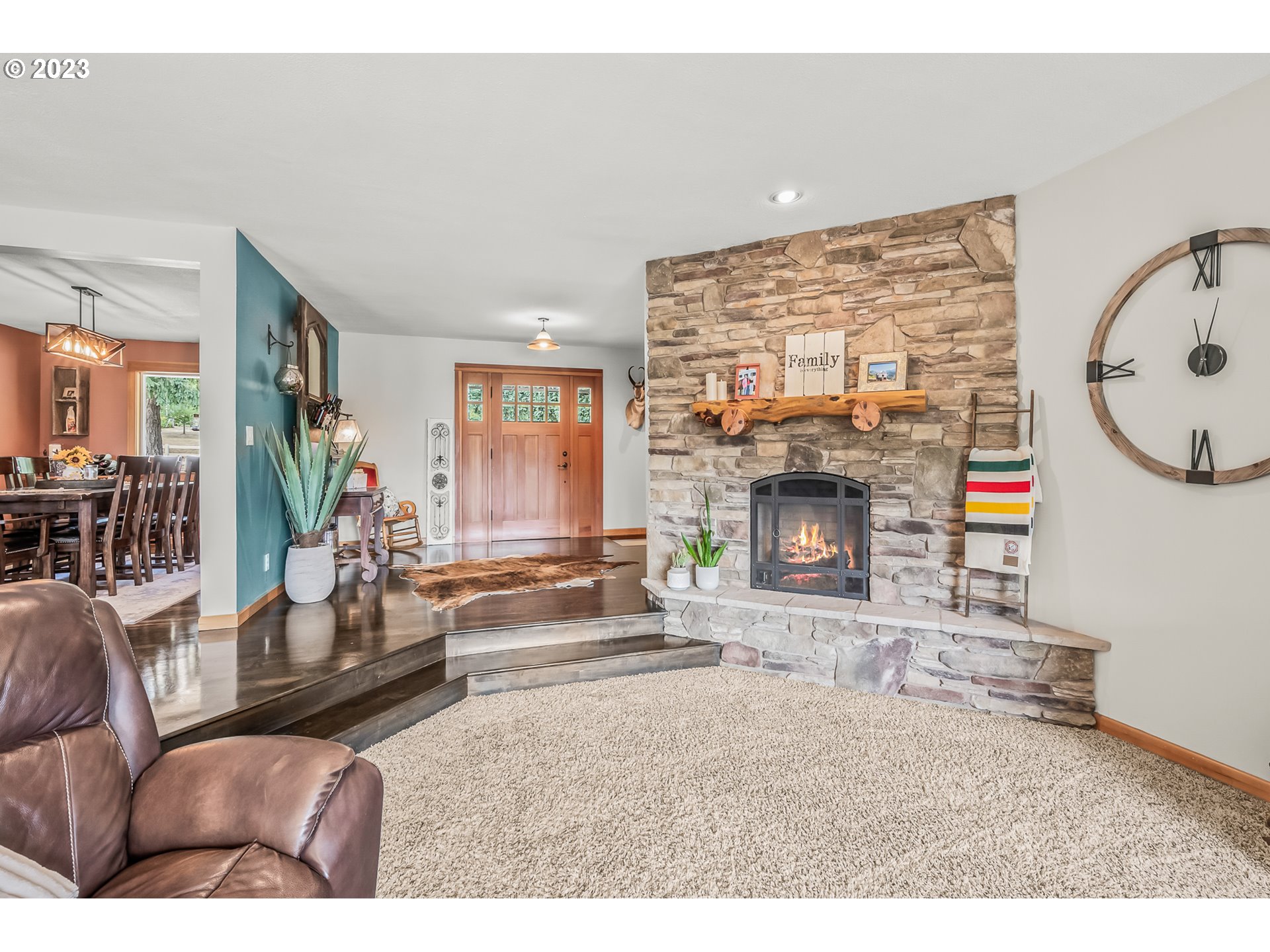 32311 Viewcrest Drive Warren, OR 97053 - Photo 10 of 46 a living room with fireplace furniture and a fireplace