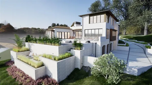 a front view of a house with garden