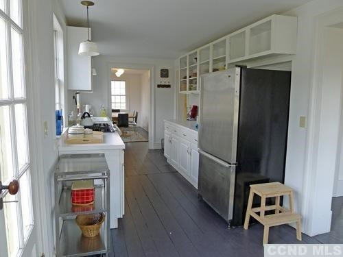 17 High Meadow Road Copake, NY 12516 - Photo 3 of 10 a kitchen with a refrigerator and a stove
