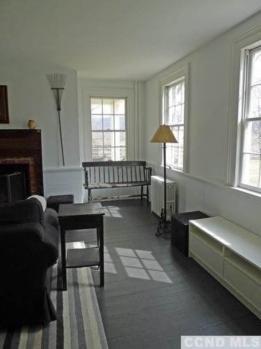17 High Meadow Road Copake, NY 12516 - Photo 8 of 10 a living room with furniture and a fireplace